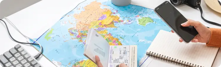 map with passport and cell phone