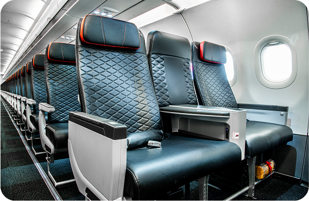 Siège Premium Business Class spacieux avec appuie-tête réglable et plus de confort à bord